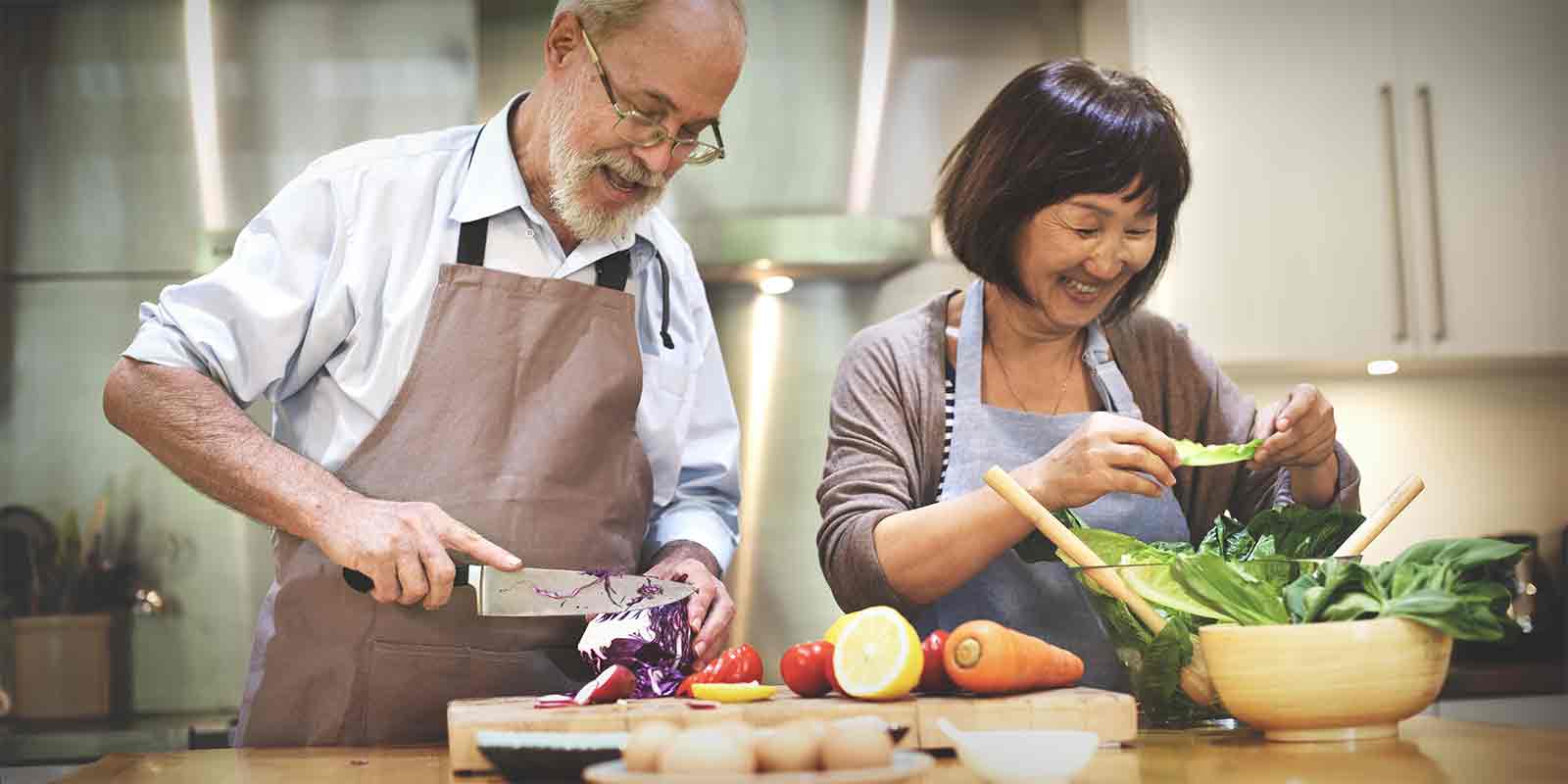 couple cooking after getting Term Life Insurance