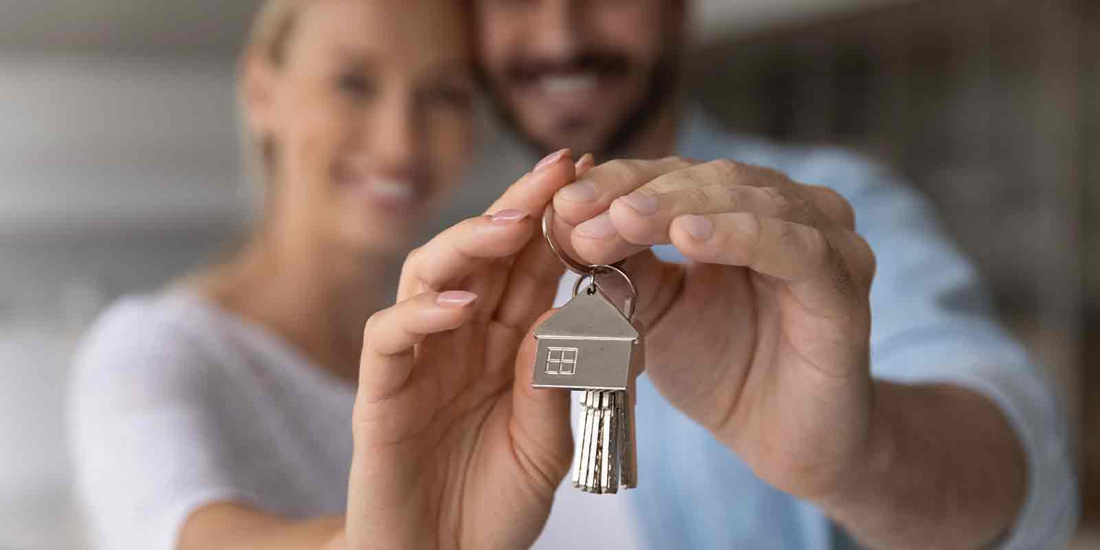 couple showing their keys from Renters Insurance
