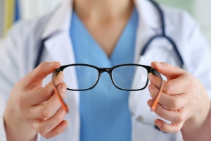 female doctor using Group Vision Insurance