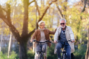 active couple on bike with Term Life Insurance