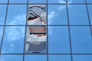 a commercial office building that has shattered glass causing a business interruption