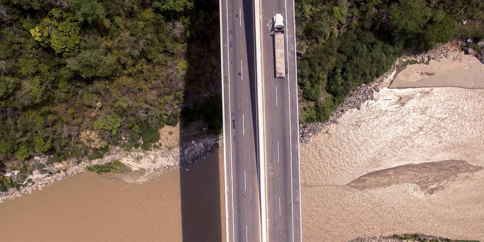 a delivery truck cross a flooded bridge