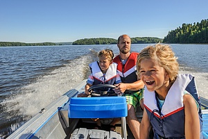 a father spending time with his kids on a boat