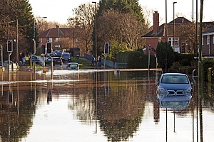 a street view of a residential street flooded