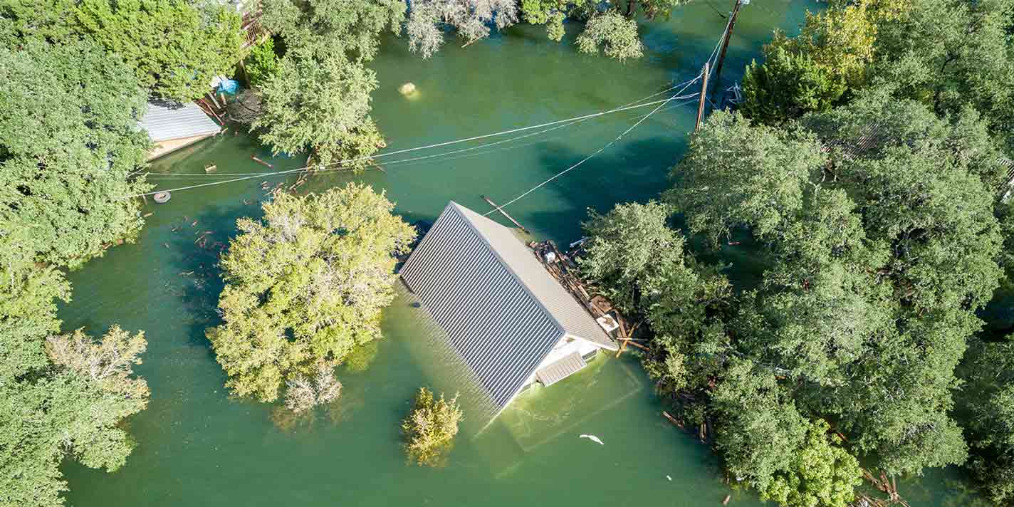 an aerial view of a home completely flooded