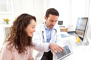 a doctor explaining the lab results to his patient