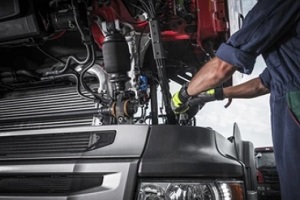 man repairing truck