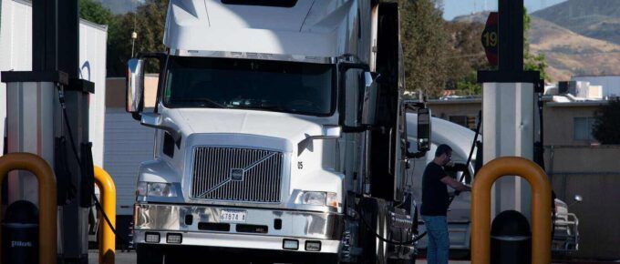 trucks fueling at a truck stop in California paying some of the highest diesel fuel prices in the nation
