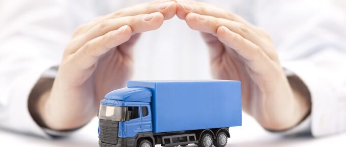 truck miniature covered by hands