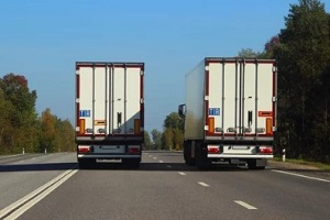 two trucks in highway