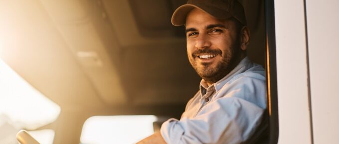 portrait of happy truck driver looking at camera