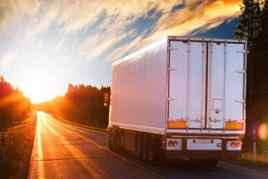 truck on highway during sunset