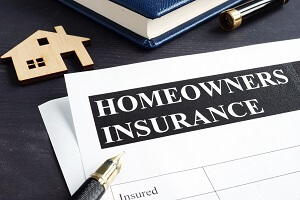 homeowners insurance policy and model of home