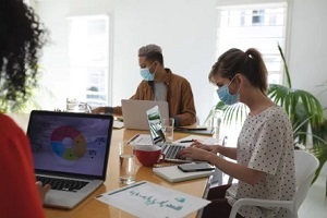 employees working in the office wearing mask