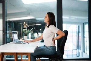 female employee suffering from backpain