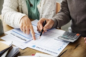 people filling health insurance form