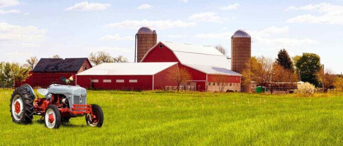 traditional american red farm with tractor