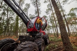 forestry machine operator exiting cab