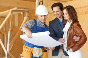 worker shows house design plans