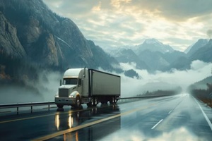 truck with transporting frozen cargo in refrigerated semi trailer moving on the road along mountains