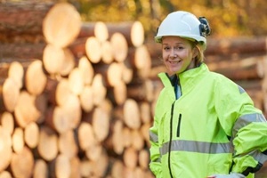 female logging worker in the yard