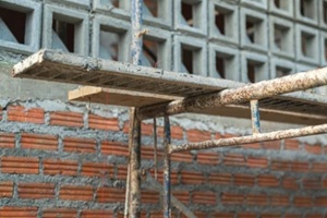 metal scaffolding structure at the housing construction building site