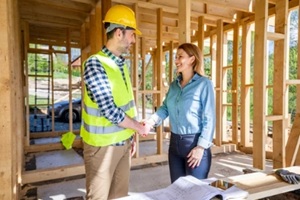 home builder shaking hand with the owner