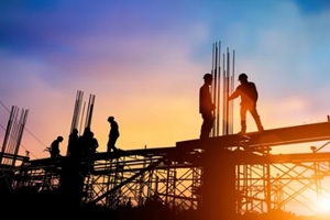 silhouette engineer standing orders for construction crews to work