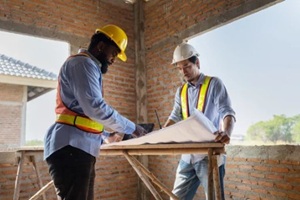 construction workers collaborating on a building project at a construction site in the daytime