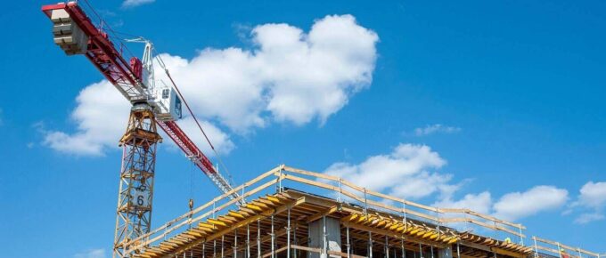 apartment building under construction on a sunny day