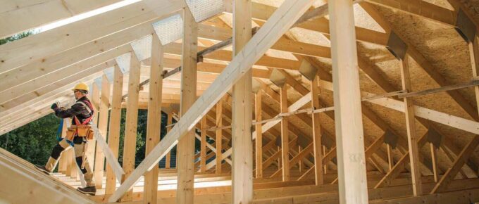 wooden roof skeleton frame of building - residential construction insurance