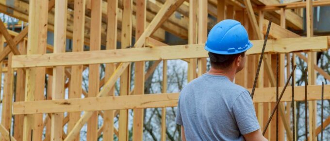 builders on construction site new home under construction