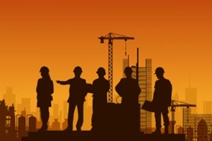 executives and construction consultants meet in a glass office to review blueprints